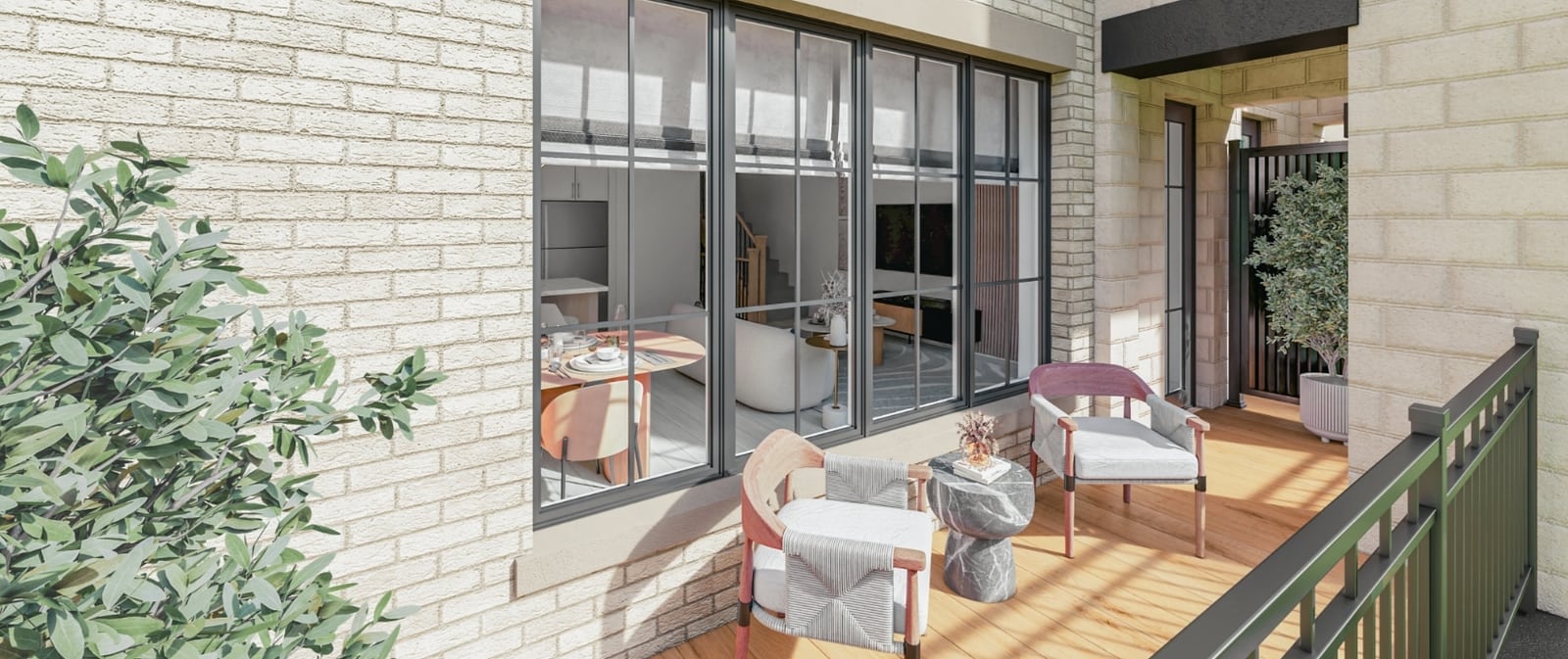 Rendering of a private ground-level patio at OG Urban Towns with seating, opening onto the living and dining area through full-height glazing