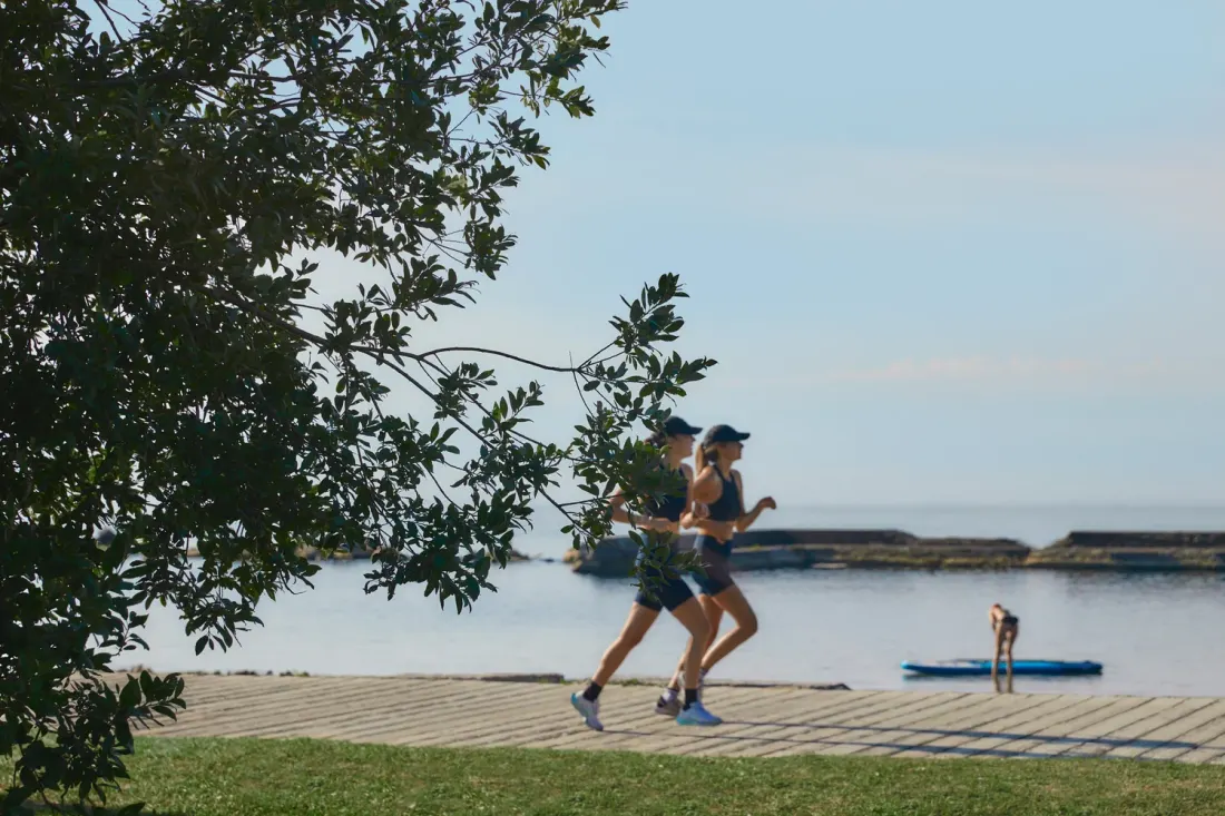 Runners on the lakefront boardwalk